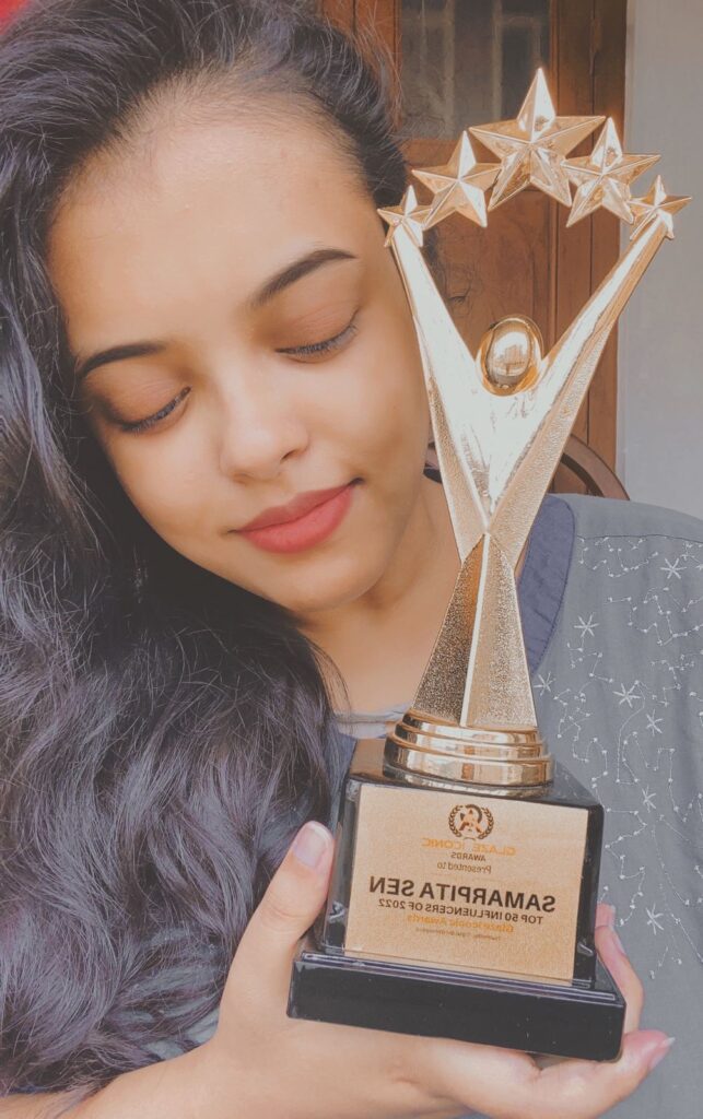 Samarpita Sen was born and raised in Kolkata..She graduated with an honours degree from Calcutta University in 2018. She is employed in a variety of social media platforms, such as Roposo and Moj, ShareChat etc... She has also won awards such as best artist from the Golden Arc Award, Asia 100 Women, Foxcluse 100 Top Women, etc. She also won several national awards...