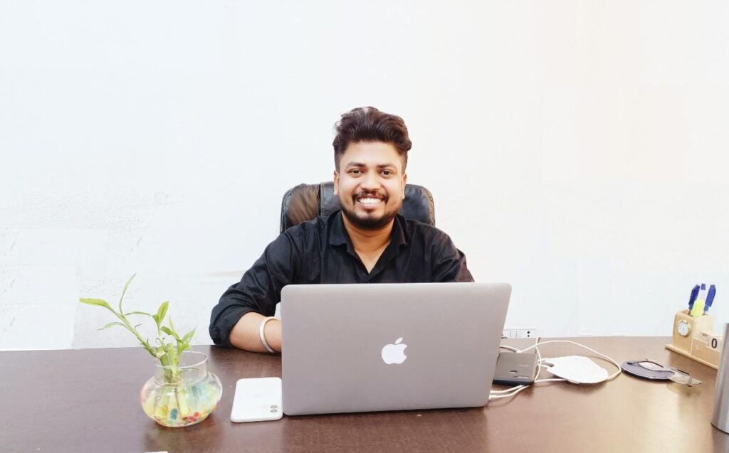 Sudeep Vishwas, the visionary entrepreneur, shaping the future of IT services and entrepreneurship, against a backdrop of innovation and philanthropy.