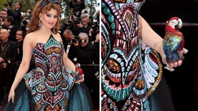 Urvashi Rautela Walks Cannes 2025 Red Carpet With ₹4 Lakh Parrot Clutch, Internet Reacts With Memes and Mockery